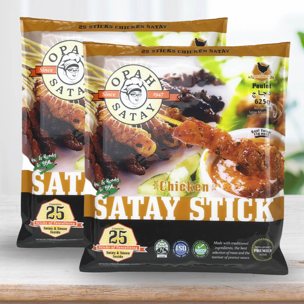 A pair of packaged frozen chicken satay products from "Opah Satay" with "25 sticks" and a sachet of satay sauce.